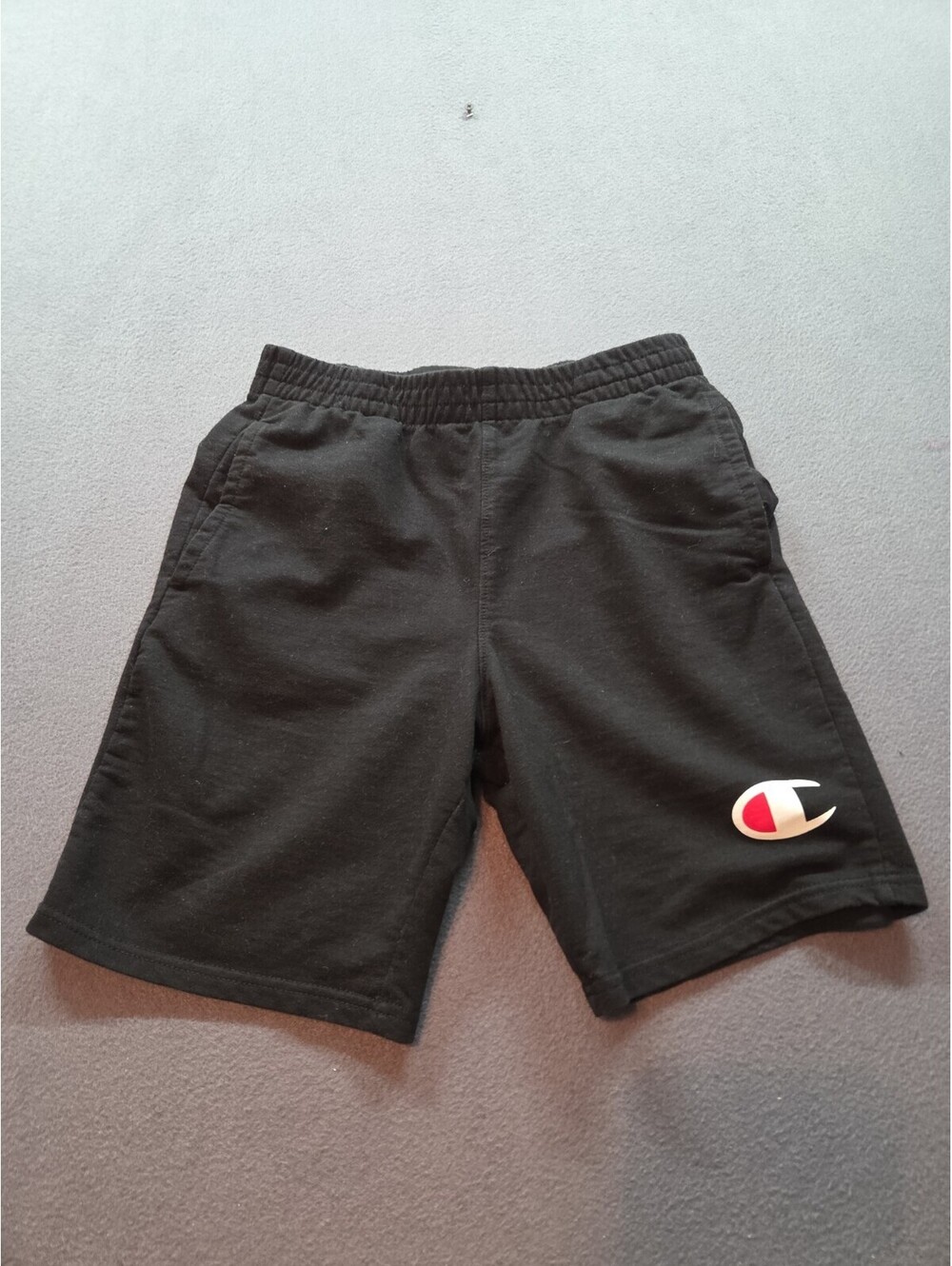 boy's black sweat shorts by Champion size L